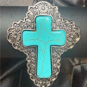 NWT Faux Turquoise and silver tone cross bracelet.  Adjustable cuff.